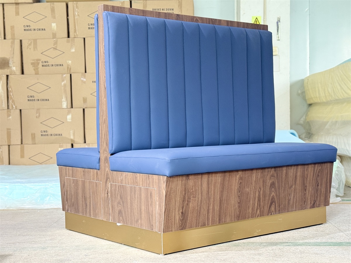 Contemporary two-sided restaurant booth with blue faux leather upholstery and wood grain details