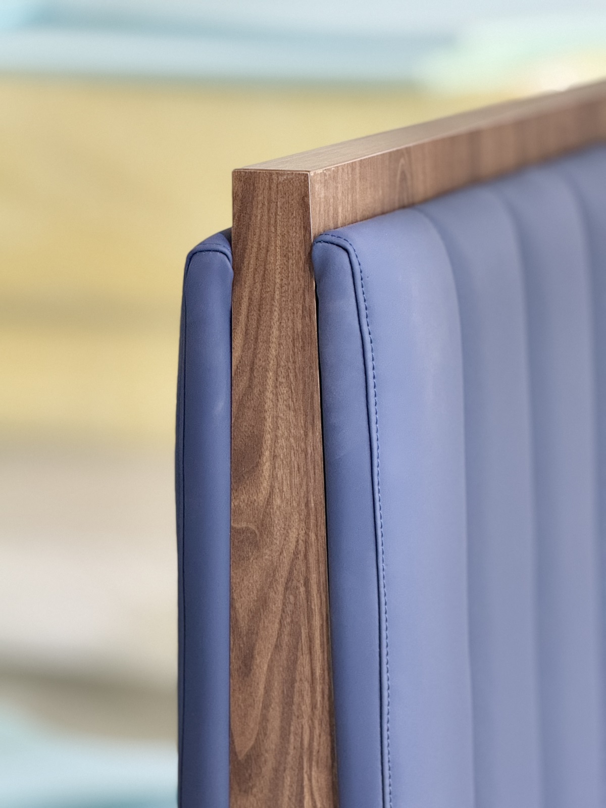 Stylish double-sided booth seating with cushioned backrest and sleek wood grain finish