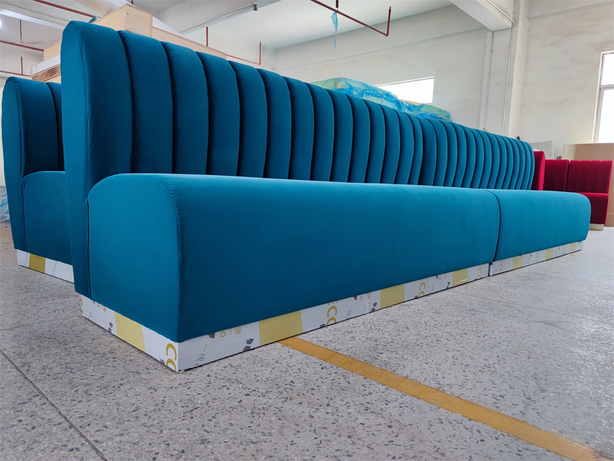 Long upholstered restaurant bench with vertical tufting