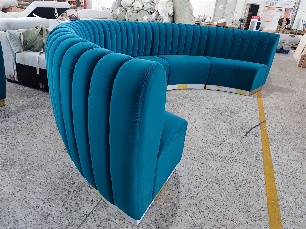 Custom semi-circular hospitality sofa seating in teal blue velvet
