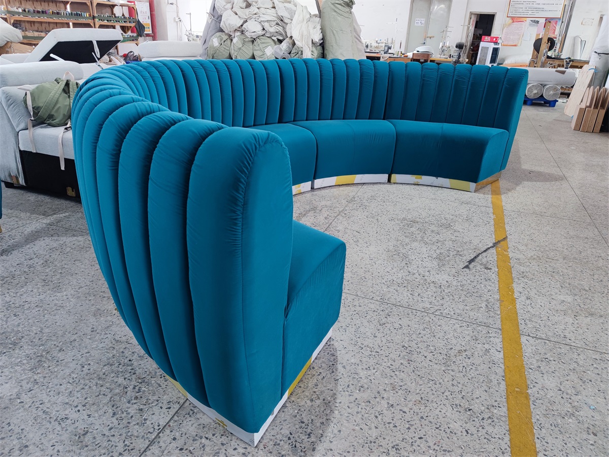 Custom hotel lobby banquette with plush velvet and curved design