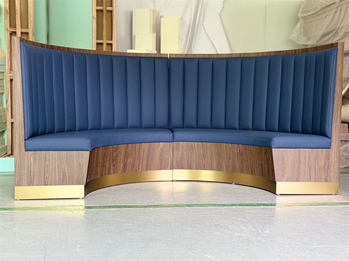 Custom restaurant booth with blue leatherette upholstery and metal trim