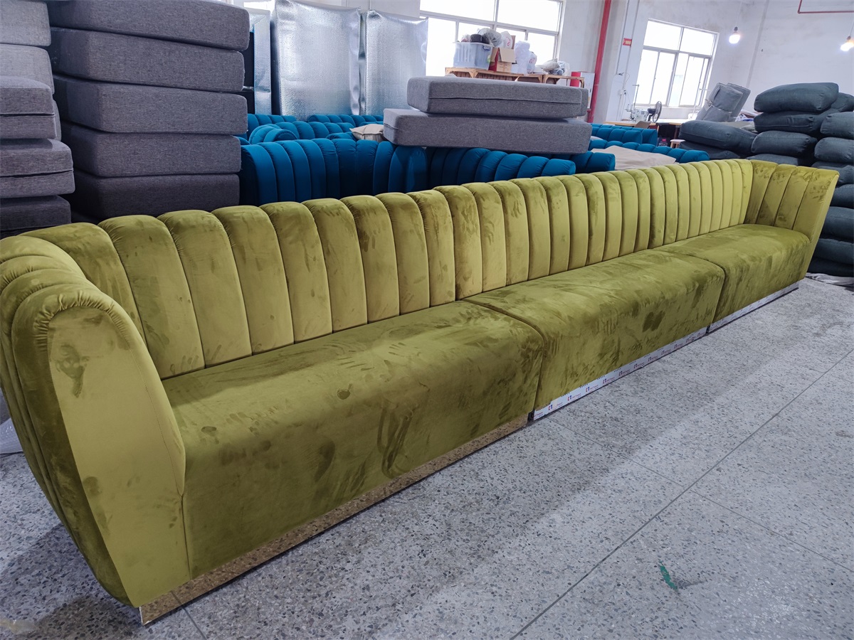 Upholstered banquette seating in green velvet fabric