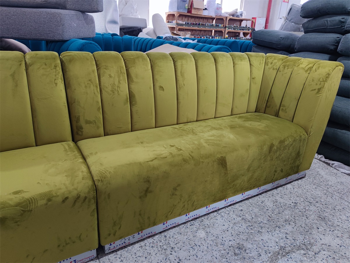 Upholstered banquette seating in green velvet fabric
