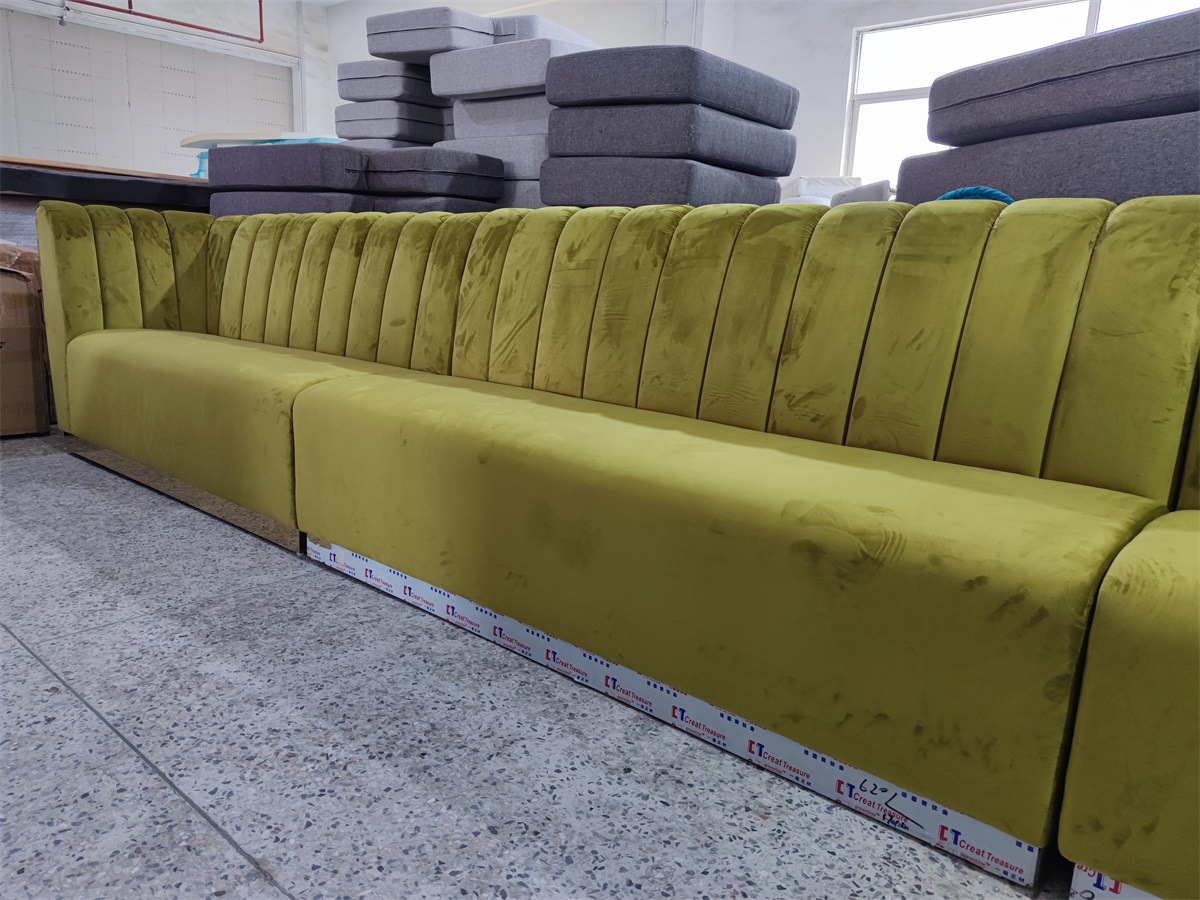Upholstered banquette seating in green velvet fabric