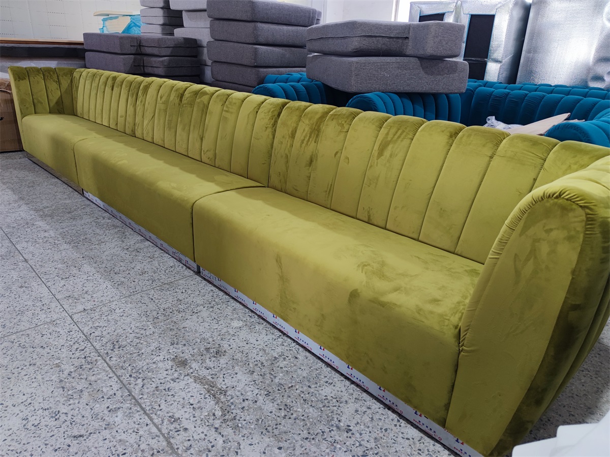 Upholstered banquette seating in green velvet fabric
