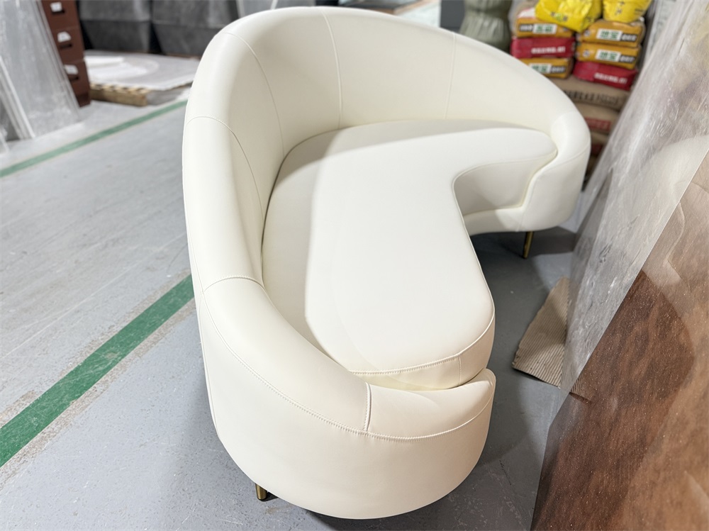 Curved white faux leather sofa for hotel lobby