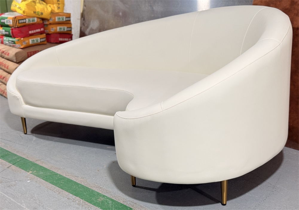 Contemporary hotel seating with curved back and gold base