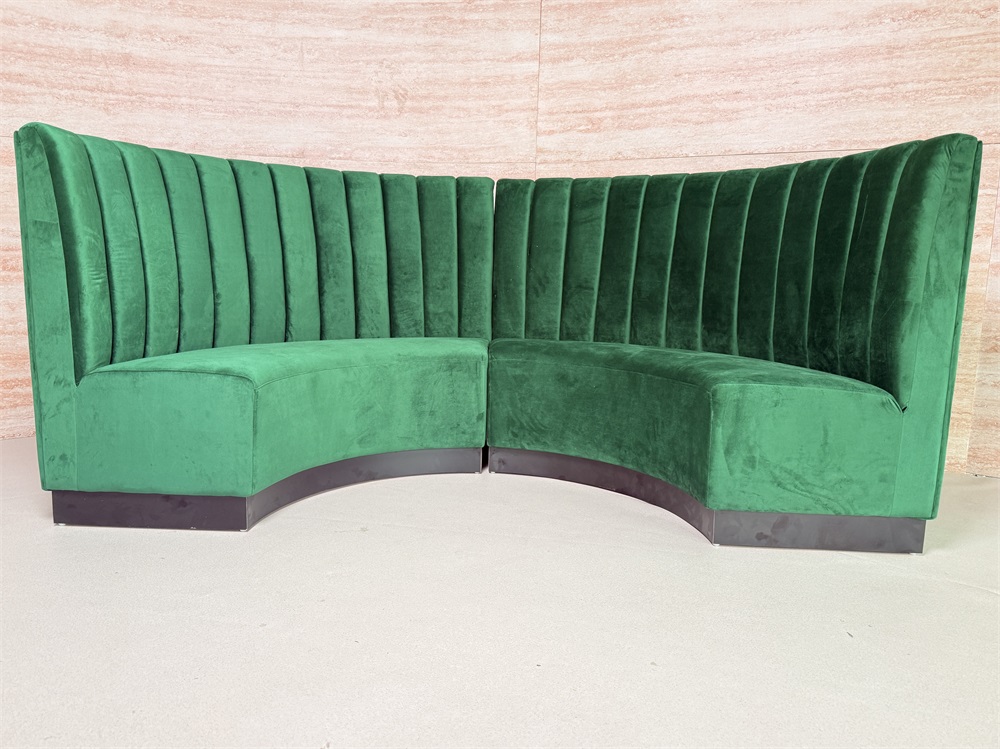 Curved green velvet high back booth seating for restaurant or lounge interior