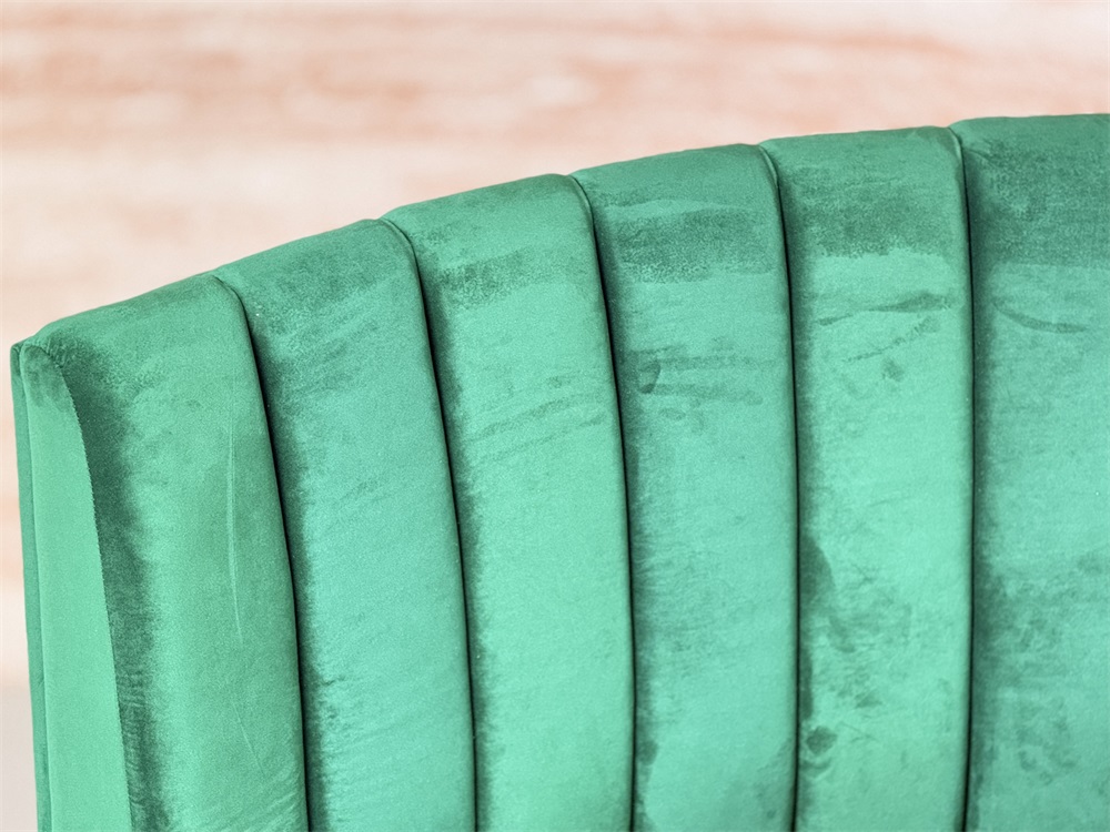 Custom high back green velvet banquette seating for hospitality spaces
