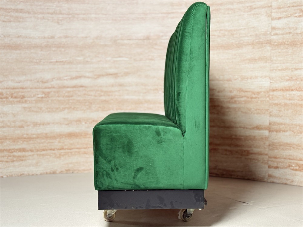 Custom upholstered booth seating in teal velvet and purple base